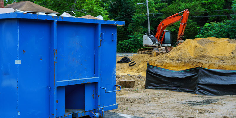 dumpster placed at work site