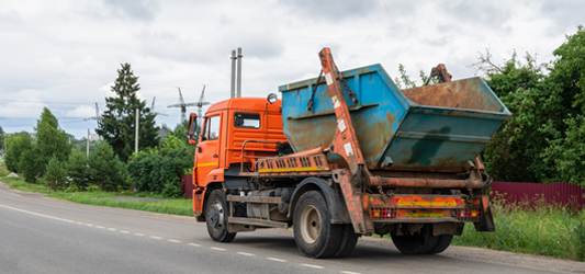 Roll-off dumpster on dumpster truck