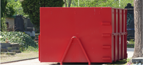 red roll-off dumpster sitting in road