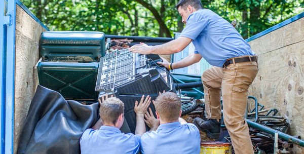 Junk removal crew loading a truck