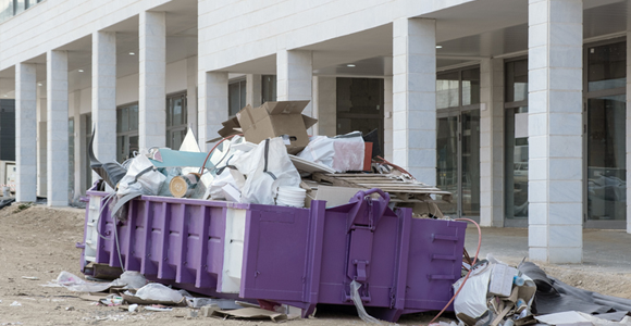 Roll-off container overloaded with trash