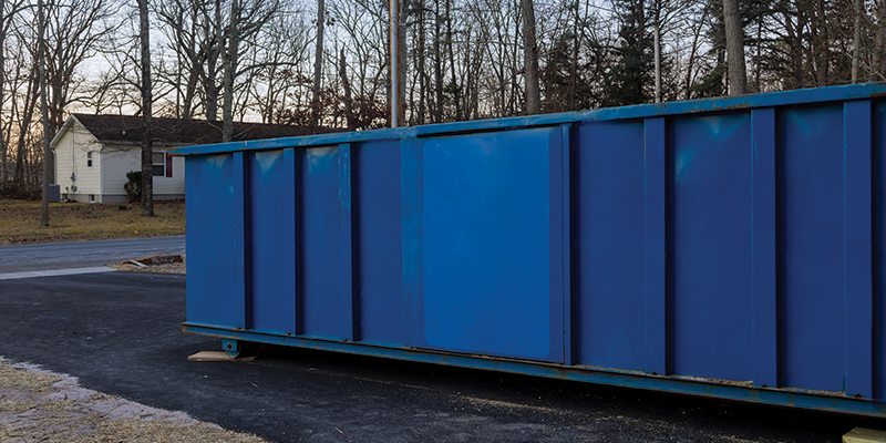 dumpster in driveway