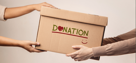 person handing off donation box