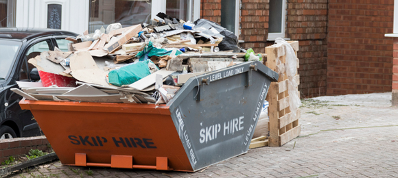 filling a dumpster too high can cause problems