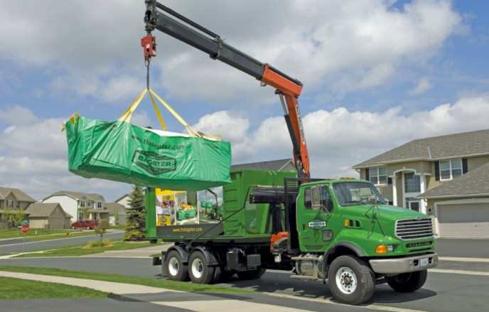 Bagster being picked up by Waste Management truck