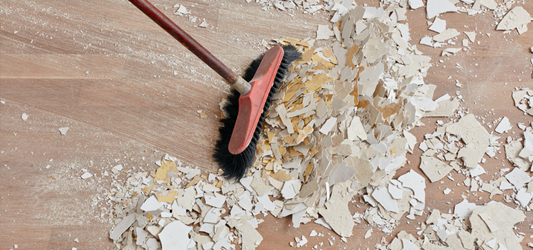 Sweeping up drywall debris