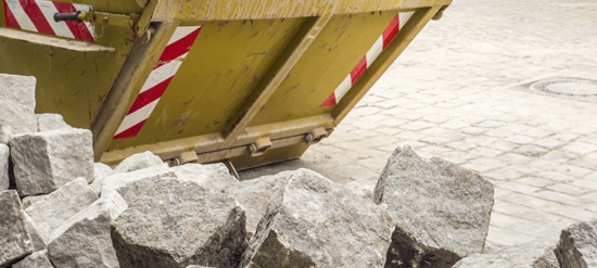 concrete debris in a dumpster