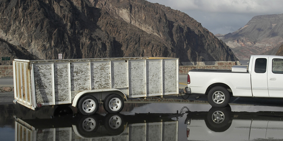 trailer dumpster hitched to truck