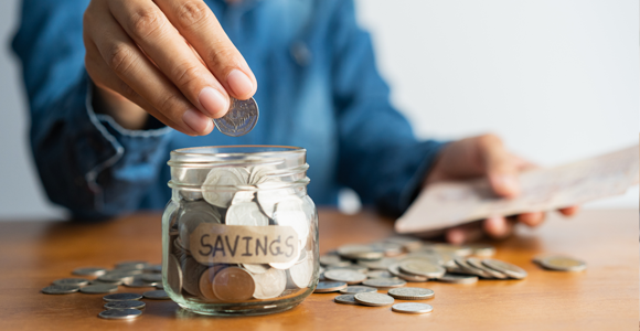Putting change into a "savings" jar