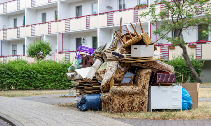 Pile of junk outside apartment complex