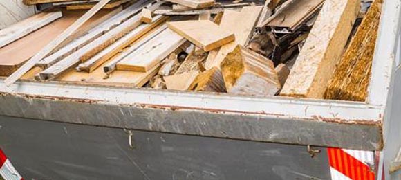 dumpster full of scrap lumber