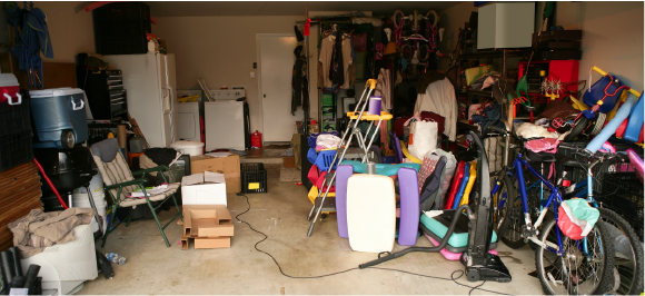 cluttered garage filled with kids' toys and sports equipment