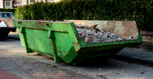 Roll-off dumpster full of construction and demolition debris