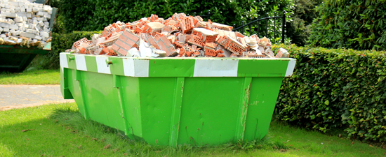 dumpster clean loaded with brick