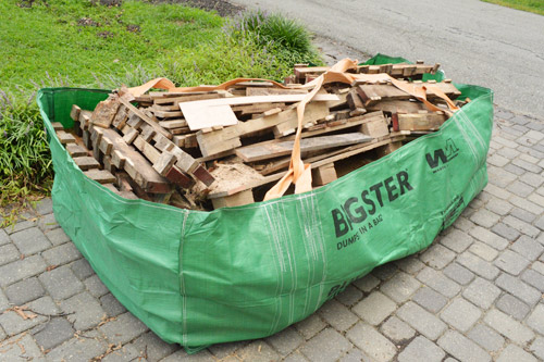 Easily remove junk around your home or business with The Gator Dumpster Bag