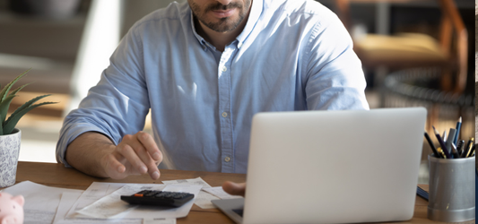 person calculating a price estimate on the computer