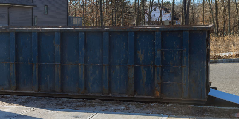 dumpster in driveway