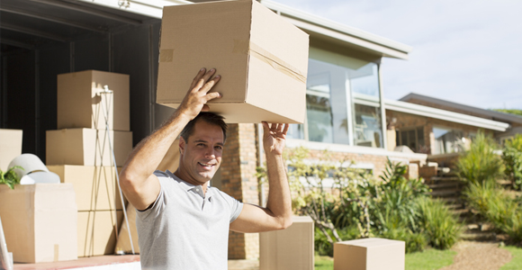 man moving boxes out of home