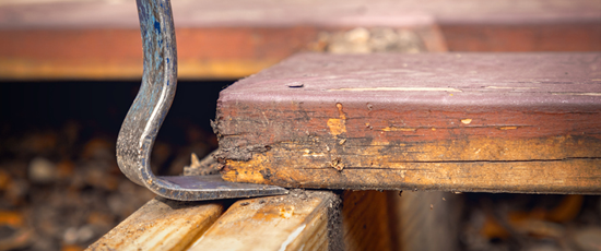 removing a wooden deck board