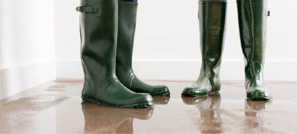 rubber boots standing on wet floor