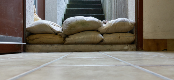 Sand bags creating a barrier against flooding