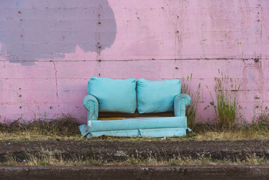 old couch at the side of the road