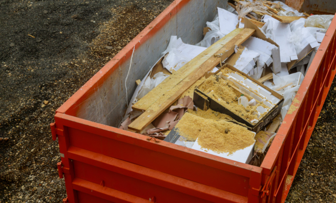 Open top dumpster with debris inside