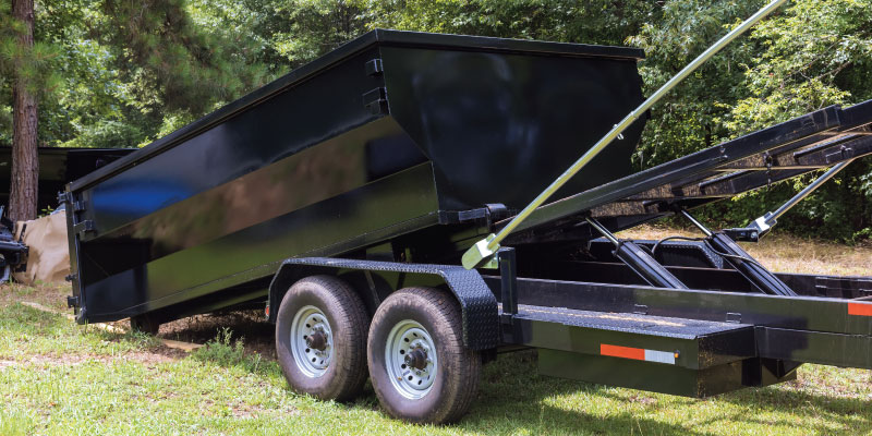 dumpster being dropped off