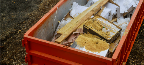 overhead view of dumpster with demo debris