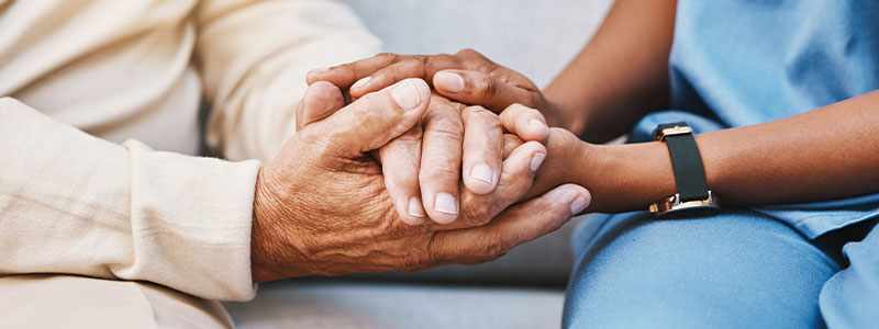 holding older person's hands