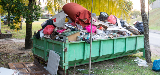 Roll-off dumpster overflowing with trash