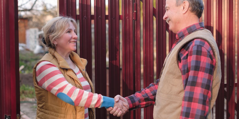 neighbors shaking hands