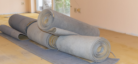 Pile of old, ripped up carpet