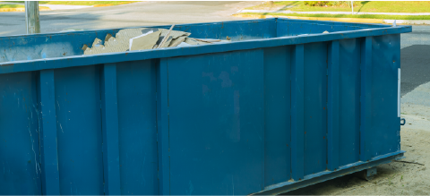 blue 30 yard dumpster in driveway